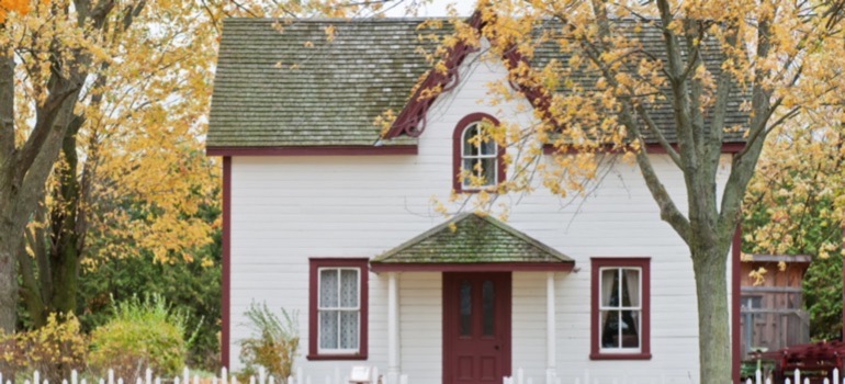 A house during the fall needing roof maintance