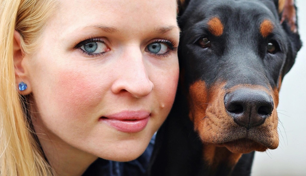 the face of a woman and her dog