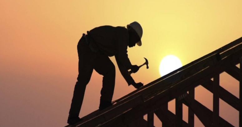 a guy on a roof making repairs