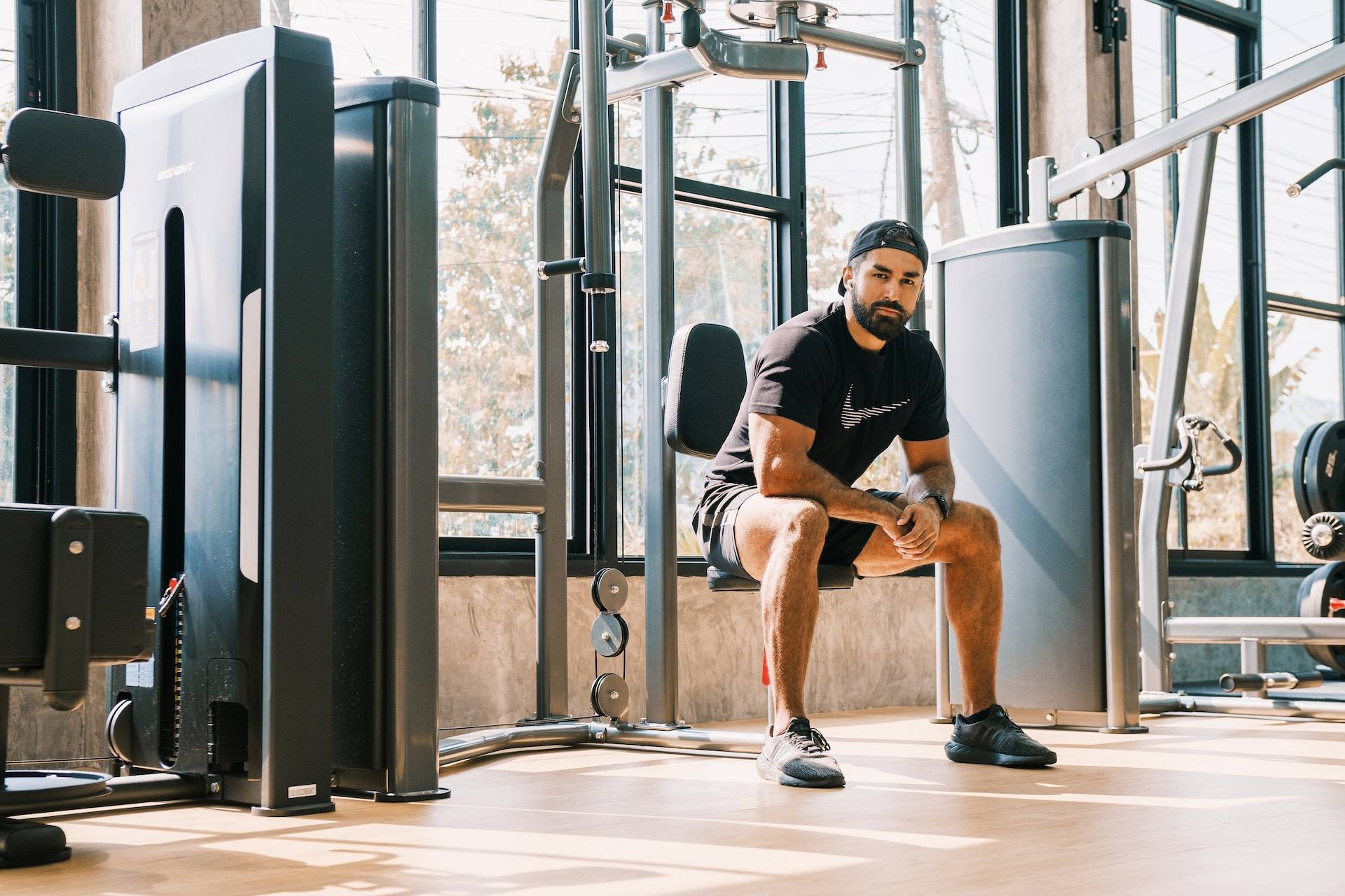 a guy sitting in a gym