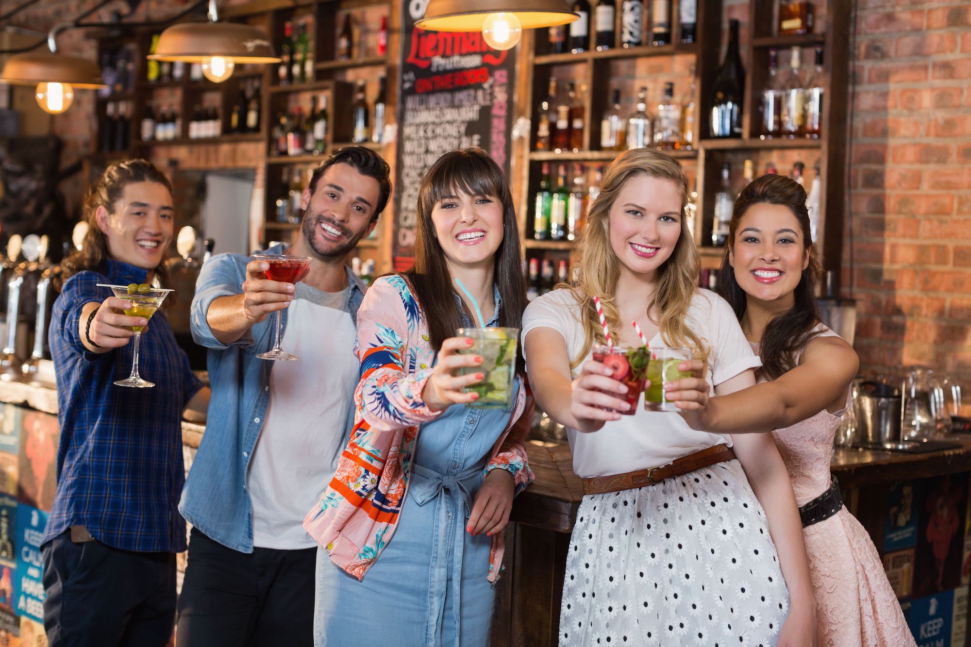 A group of people Celebrating National Rum Day With Cool Wind Media