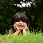 A happy little boy wanting help learning