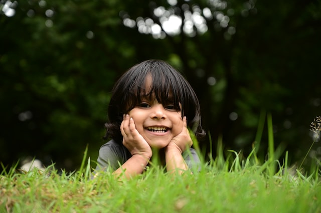 A happy little boy wanting help learning